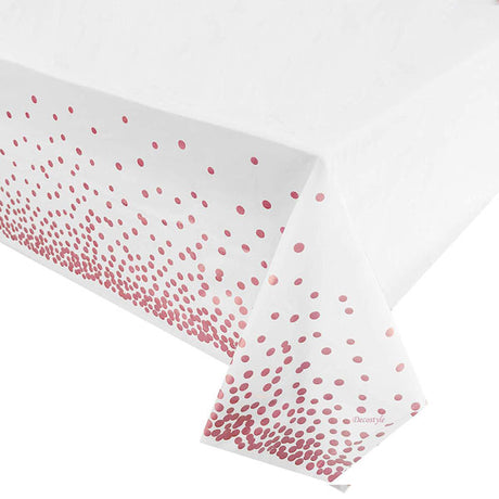 Pink dots on white table cover makes an outstanding cake table setting.