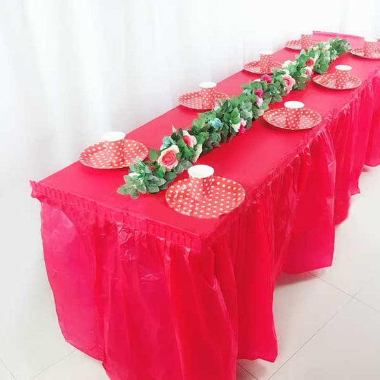 Red table setting to match lively birthday party theme
