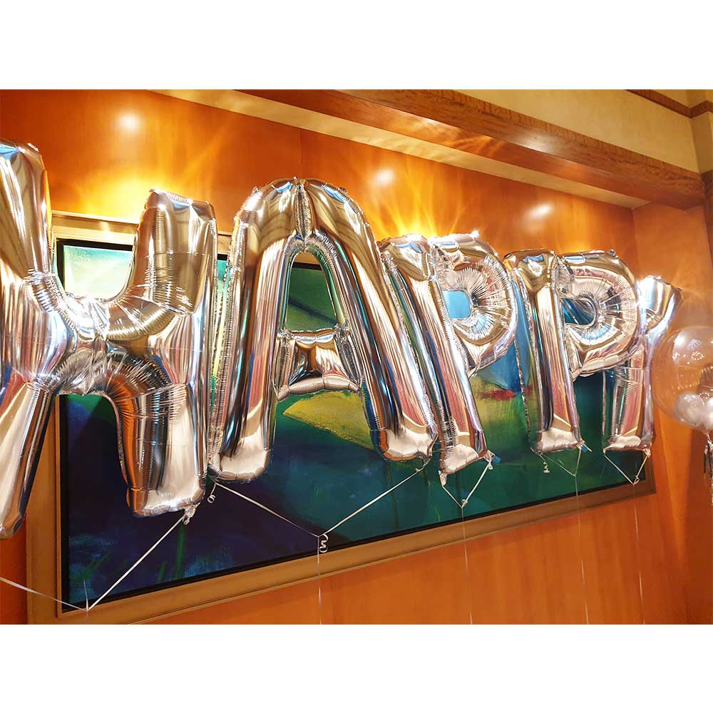 HAPPY BIRTHDAY displayed for a surprise party for the birthday girl at the hotel suite entrance.