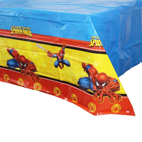 Spiderman red, yellow and blue table cover for dressing up the cake table to be photo-friendly.