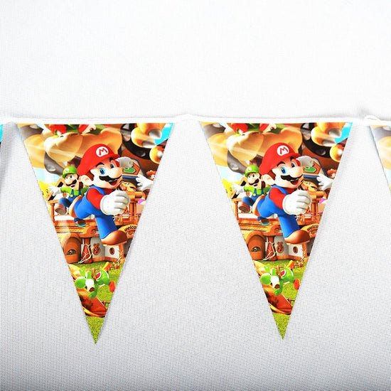 Super Mario flag banner to enhance the party decorations and atmosphere to Kendrick's birthday party. Everyone is so happy and in high spirits.