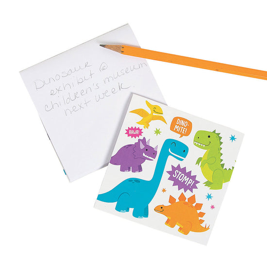 Load image into Gallery viewer, The Trendy Dinosaur Note Pad is also great for kids, whether they&amp;#39;re using it for homework or just scribbling down their latest dino discoveries. It makes a great gift for anyone who loves dinosaurs, and is sure to add a touch of prehistoric fun to any desk or workspace.
