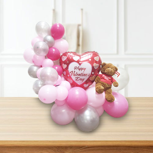 Lovely balloon sculpture with a nice Valentine's Day Balloon as a centerpiece. Add a I Love You Gund Bear to complete the gift.