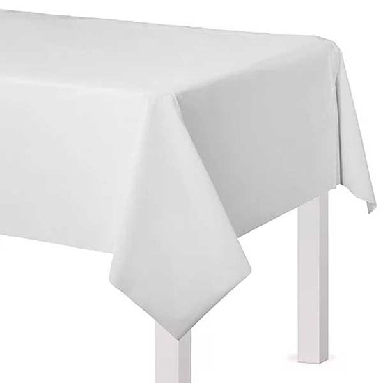White table cover for simple cake table set up for wedding recept.